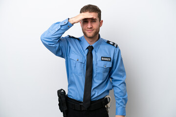 Young police caucasian man isolated on white background looking far away with hand to look something