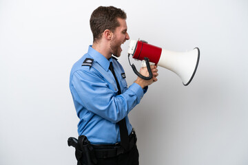 Young police caucasian man isolated on white background shouting through a megaphone