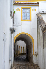 Streets of the old town of the city of Evora (World Heritage Site by UNESCO) with its typical white...