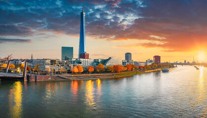 incredible autumn sunset on the rhein river spectacular evening cityscape of dusseldorf with...