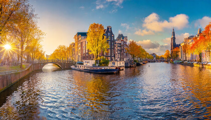 panoramic autumn view of amsterdam city famous dutch channels and great cityscape colorful morning...
