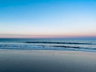 Fototapeta na wymiar Calm sea horizon, early morning, before the sunrise at the sea, pastel colors
