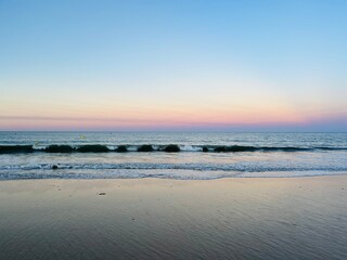 Fototapeta na wymiar Calm sea horizon, early morning, before the sunrise at the sea, pastel colors