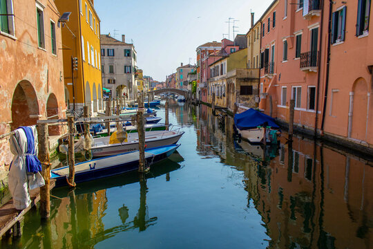 Chioggia town in venetian lagoon, water canal and boats. Veneto, Italy, Europe