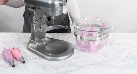 Fototapeta na wymiar Mini Vanilla Cupcakes with Pink Buttercream Frosting