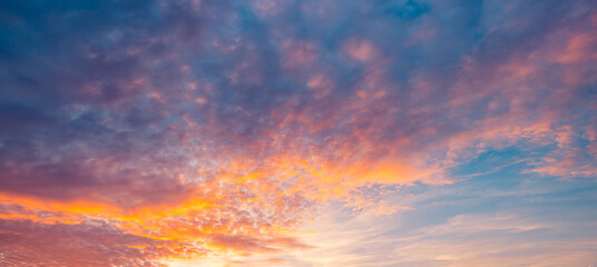 Majestic morning colorful sunlight sky clouds. Heavenly light reflected on fluffy clouds in golden...