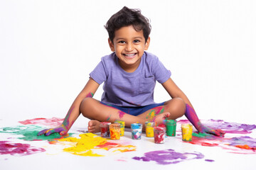 indian boy painting with hands - obrazy, fototapety, plakaty