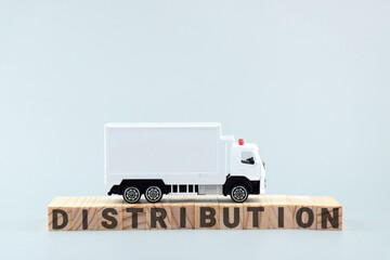 White toy truck on blocks with the text DISTRIBUTION.