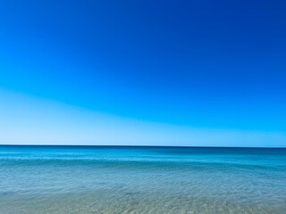Transparent blue sea water, blue sea horizon, pure sky, natural blue seascape background