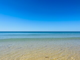 Fototapeta na wymiar Transparent blue sea water, blue sea horizon, pure sky, natural blue seascape background