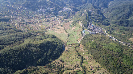 Drone flight above authentic rice terraces near Fuzhi mountain Dongcheng village at Shaoxin, Zhejiang provnice, China. High angle view of rice terrace fields in mountains.