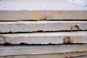 Fototapeta premium Large construction debris, concrete slabs and blocks