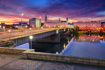 Fototapeta na wymiar Linz, Austria. Cityscape image of riverside Linz, Austria at autumn sunrise with reflection of the city lights in Danube River.