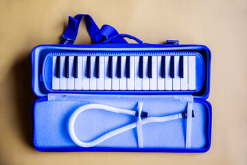 blue white melodeon or pianica blow organ musical instrument for children