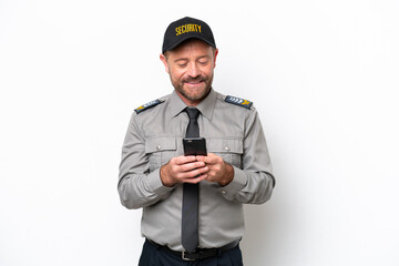 Middle age security man isolated on white background sending a message with the mobile