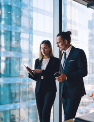 Mature caucasian male and female company workers dressed