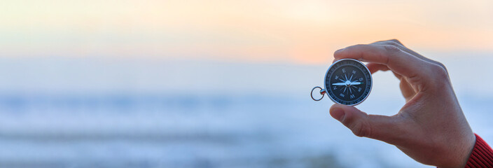 man holding compass © Daniel