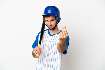 Young caucasian man playing baseball isolated on white background making money gesture