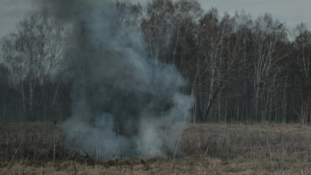 No people wide shot of shells exploding on battlefield on autumn day, WWII reenactment