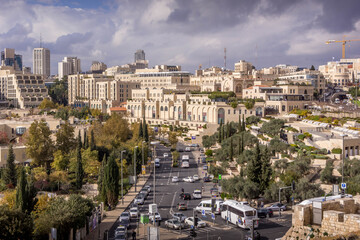 Fototapeta premium The downtown of Jerusalem, Israel, with the street road, David Citadel Hotel and shopping mall during the cloudy autumn day.