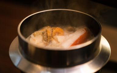 Seafood rice in hot rice pot. Japanese food.