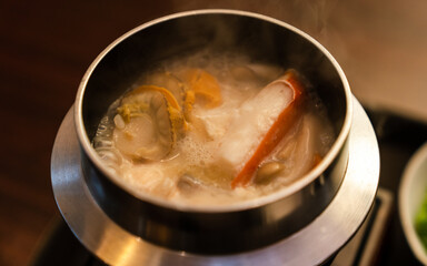 Seafood rice in hot rice pot. Japanese food.