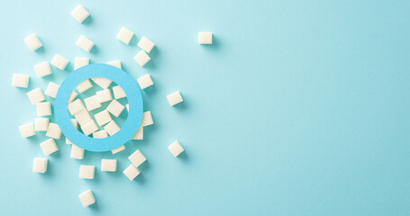 Raise Diabetes Awareness: Top view of a blue circle emblem on a pastel blue background with refined...