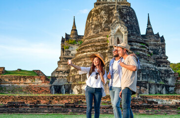 group of young multi ethnic friend taking a selfie while visiting at Wat Phra Si Sanphet,Ayutthaya...