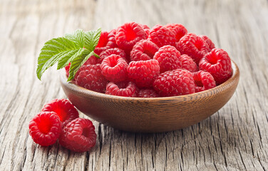 Raspberry on wooden old background