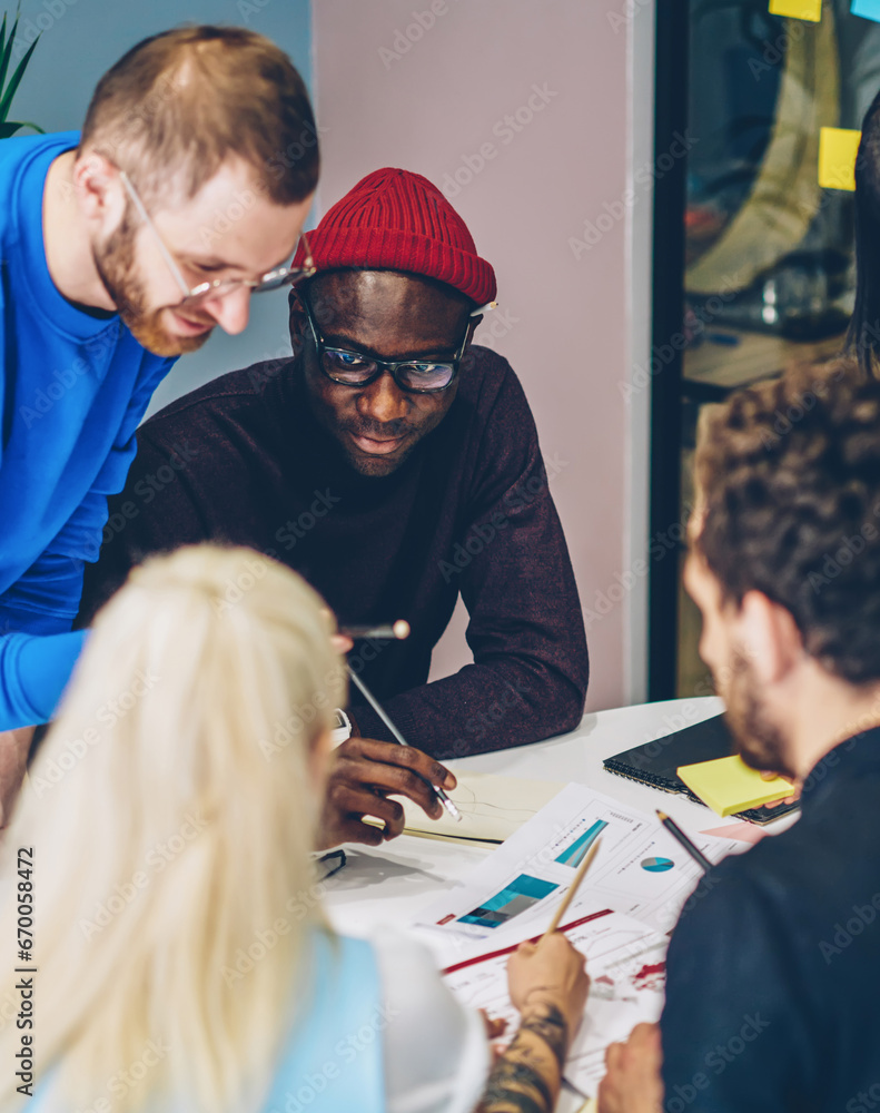 Poster crew of multiracial employees cooperating during brainstorming session solving problems