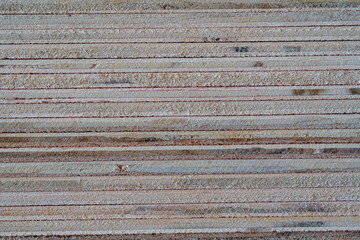 Closeup shot, Cross section of cut plywood board, Stack of industrial plywood in construction site...