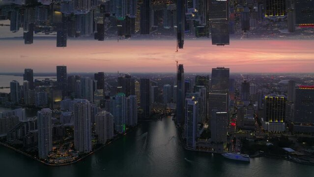 Beautiful aerial panoramic shot of high rise downtown buildings in metropolis at dusk. Miami, USA. Abstract computer effect digital composed footage