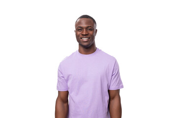 Fototapeta premium young adorable african man with short haircut wearing lilac t-shirt