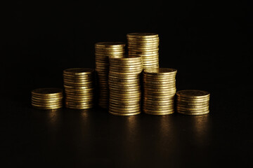 Gold coins on black background, Saving money concept