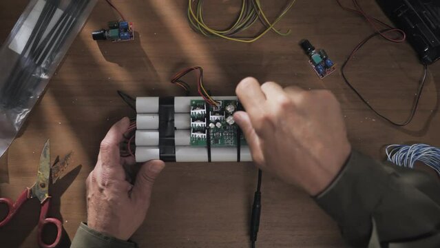 making building homemade pipe bomb top view,criminal terrorist assembling ied explosive device