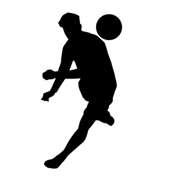 Silhouette of a male soccer player kicking a ball. Silhouette of a football player in action pose.