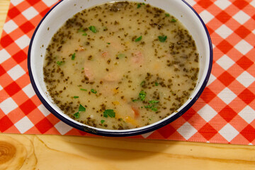 Traditional Polish soup Zurek on a table