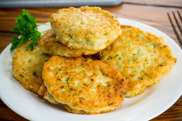 cooked fried potato cutlets with herbs - obrazy, fototapety, plakaty
