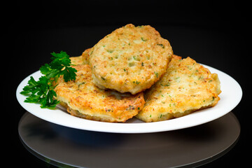 cooked fried potato cutlets with herbs