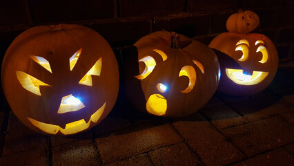 Carved pumpkin halloween jack-o-lanterns, each with their own personality...although it seems one...