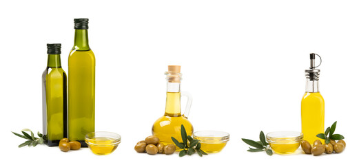 Olive oil in a bottle isolated on white background. Oil bottle with branches and fruits of olives. ...