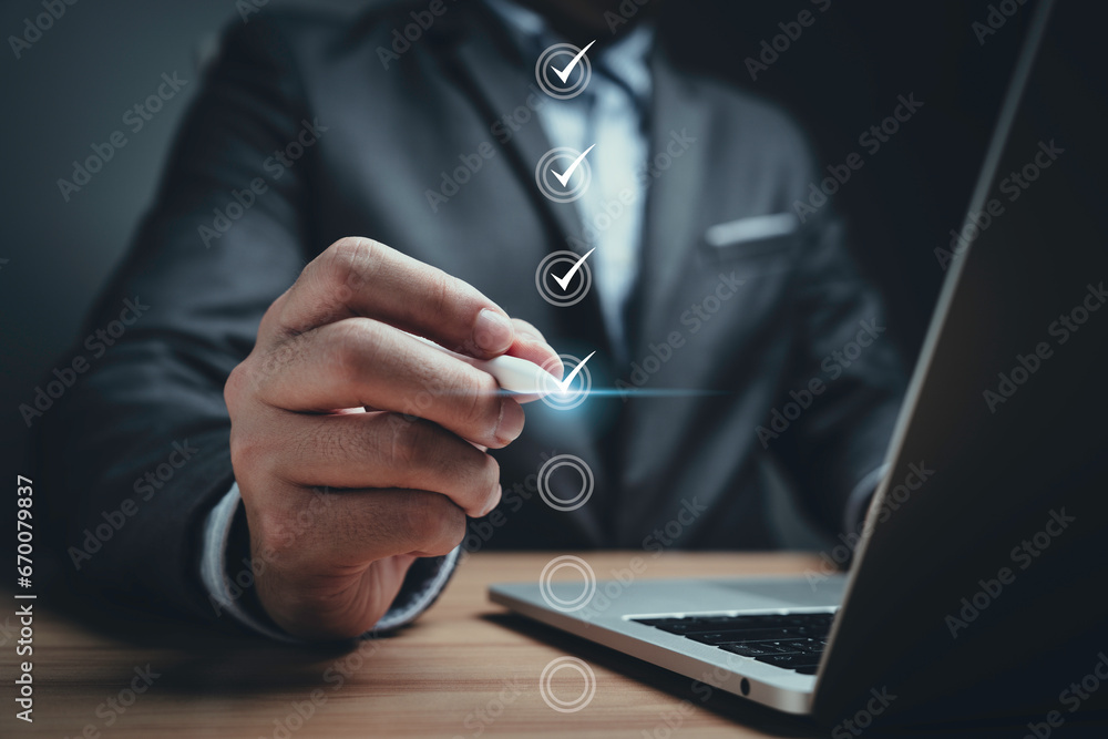 Poster businessman using electronic pen to tick correct sign mark in online document checklist for quality 