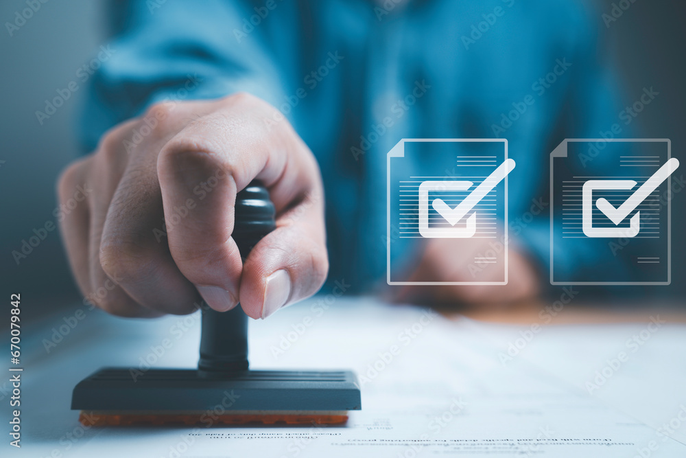 Poster Businessman using rubber stamping on paper with correct sign mark symbol and electronic doc icon for document approve and project pass concept.