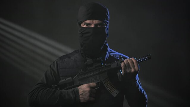 portrait of mercenary soldier of special forces holding machine gun,private military contractor