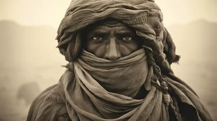 Foto op Canvas B&W sepia portrait of a Bedouin tribal elder in the desert. Exhausted, weary expression and meaningful gaze. © Archlane