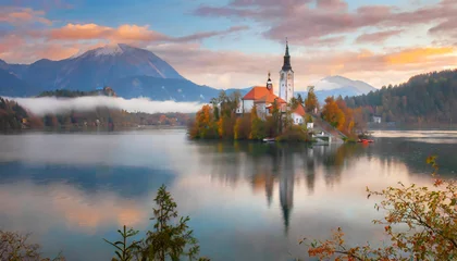 Fotobehang attractive morning view of pilgrimage church of assumption of maria impressive autumn scene of bled lake julian alps slovenia europe traveling concept background © Charlotte