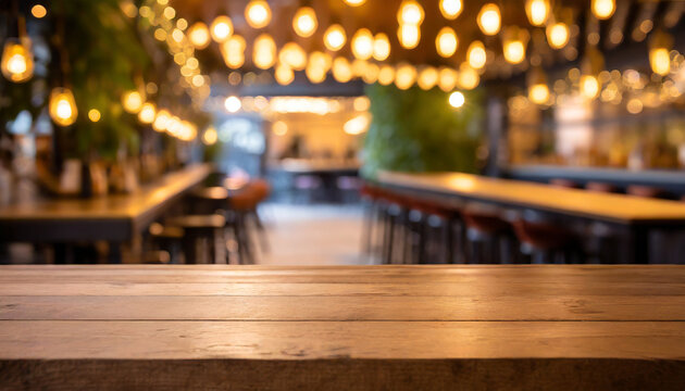 empty wooden table and blurred background of hall of stage bar or cafe with bokeh lights high quality photo