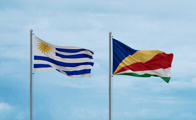 Seychelles and Uruguay flags, country relationship concept