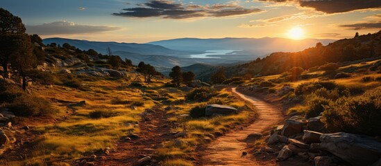 Landscape of mountain climbing trails and beautiful valley views, with sunset in the background. - obrazy, fototapety, plakaty