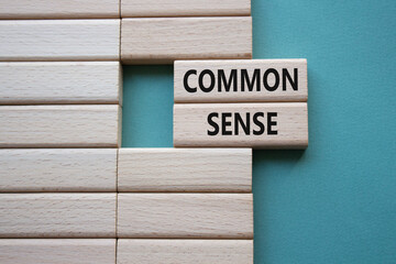 Common Sense symbol. Wooden blocks with words Common Sense. Beautiful grey green background. Business and Common Sense concept. Copy space.